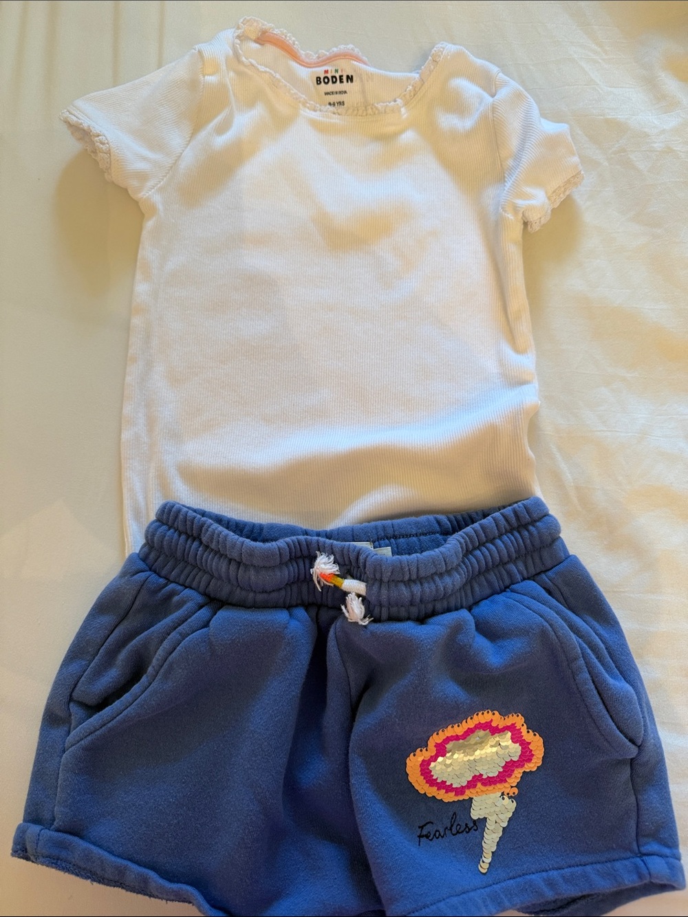 Mini Boden White Ruffle-Edge Tee with Blue Embroidered Lightning Cloud Shorts
